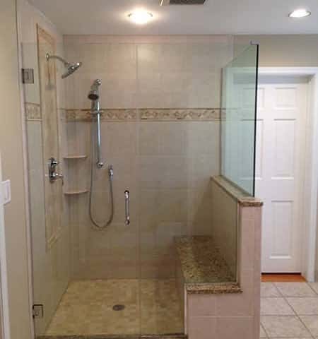 Tan Colored Tile Shower with Seat and Shelves in Schaumburg
